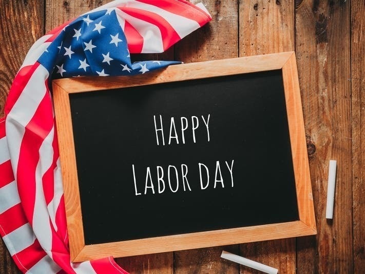 happy labor day board and american flag